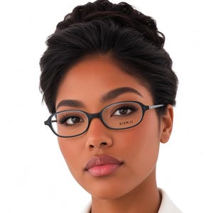 May include: Oval-shaped eyeglasses with a thin black frame. The right lens features the brand name KOOKAI printed in a small, clear font. The glasses have slender temples and a bridge that connects the two oval rims, providing a simple design.