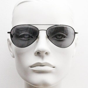 90s vintage small sized aviator sunglasses. Grey chrome metal frame with slightly mirror glazed lenses. Teardrop aviators. Pilot. Unused NOS