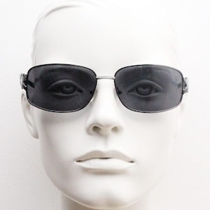 2000s vintage rectangular bug eye sunglasses. Solid metal slightly oversized grey chrome frame with diamond lattice arm detail. Y2K NOS