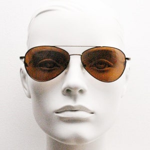 90s vintage medium sized aviator sunglasses. Brown chrome metal frame with plain brown lenses. Teardrop aviators. Pilot. Unused NOS.