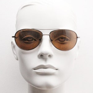 Y2K vintage medium sized aviator sunglasses. Brown chrome metal frame with curved lenses. Teardrop aviators. Pilot. Unused NOS.