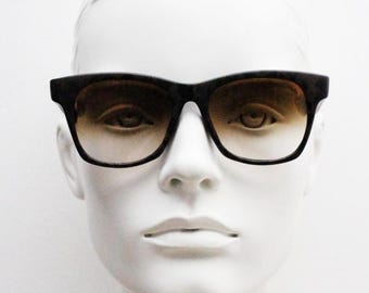 Vintage 80s square horn rim sunglasses. All time classic design in chunky matt black and brown frame with superb graduating lenses. NOS