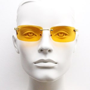 Y2K vintage frameless orange sunglasses. Rectangular lenses with gold bridge and arms. 2000s club kids. 00's. 90s Rave