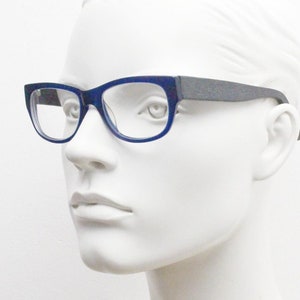 Chunky frame modified cat eye glasses. Superior quality optical eyeglasses. Deep blue front with wood look arms. Prescription RX Spectacles