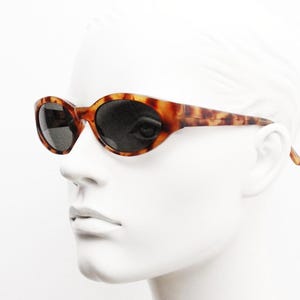 Vintage 90s oval chic cat eye sunglasses. Womens vibrant tortoise quality acetate frame with green lenses. 60s design. VGC NOS