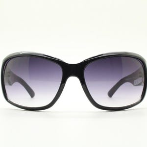 Y2k vintage wrap around sunglasses by Kenneth Cole Reaction. Curved black shield frame with gold trim. 60s bug eye design. 2000&#39;s NOS