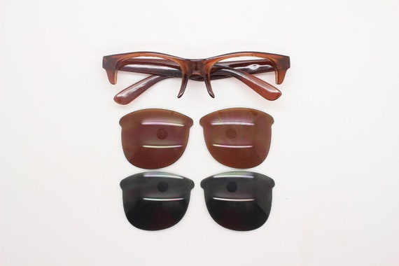 90s vintage modified wayfarer design sunglasses. Transparent brown browline half frame with brown or green interchangeable lenses NOS