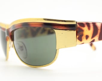90s vintage visor shield sunglasses. Substantial metal curved wraparound frame with metallic tiger brow and abstract arm patterns. NOS. BNWT
