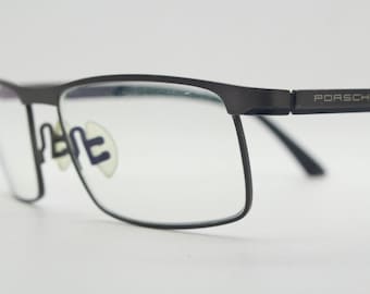 Porsche design rectangular eye glasses model 8251 made in Japan. Minimal gunmetal grey wire optical frame. Prescription RX spectacles