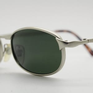 90s vintage rectangular metal sunglasses. Minimal satin finish frame with dark green lenses and tortoise ear bends. Unused NOS