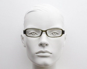 Calvin Klein Collection rechteckige Brille mit tiefem Profil. Dunkel grau marmorierte Acetat Fassungen. Korrekte Brille. Vintage RX