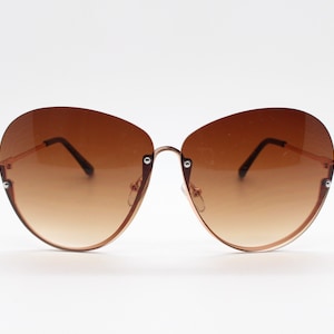 Y2K vintage large rimless sunglasses. Women&#39;s 70s style half frame design with graduating brown lenses and gold arms. 2000s BNWT
