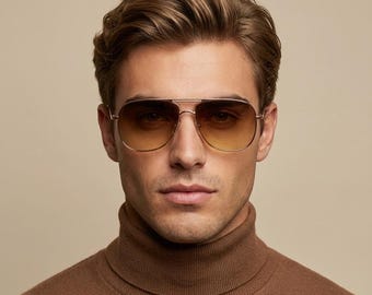May include: Aviator sunglasses featuring a thin gold metal frame and gradient lenses that transition from a darker brown at the top to a lighter amber hue at the bottom. The eyewear includes a double bridge design and adjustable nose pads.