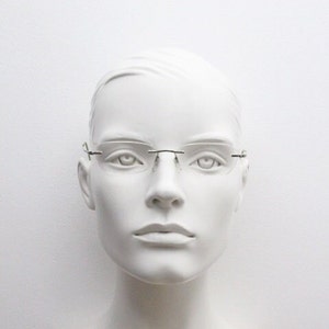 Silhouette rectangular frameless eye glasses made in Austria. Minimal lightweight optical frame with silver trim. Prescription RX