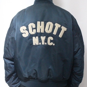 Schott NYC vintage reversible bomber jacket. Big spell out logo back in blue with red reverse side featuring white eagle. Flying MA 1.