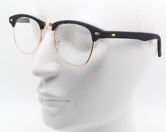 Lunettes de soleil vintage des années 90. Design classique de tous les temps en finition caoutchouc noir avec demi-cercle doré. années 50, 60. SAI non utilisé