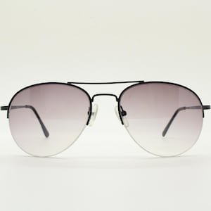90s vintage medium sized pilot aviator sunglasses. Minimal black satin finish half frame with superb smoky lenses. Teardrop aviators.  NOS.