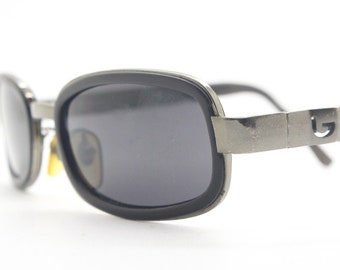 Byblos 90s vintage low profile rectangular sunglasses made in Italy. Gunmetal grey chrome frame with black insets and cut out arm logo's