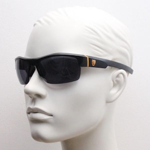 Y2K vintage sport shield sunglasses. All matt black wraparound aerodynamic visor with orange detail. 2000&#39;s. 90s. Unused NOS