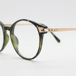 90s vintage round glasses with tortoise front and gold embossed arms. 40s, 50s style prescription optical frames. Clear lens eyeglasses. RX