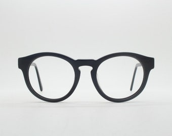 Lunettes de soleil rondes Will i Am, modèle 30715554. Monture optique en acétate noir brillant avec pont en trou de serrure. Lunettes de vue correctrices. Réception