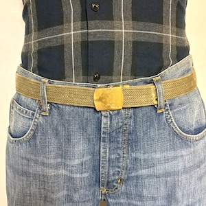 2 x bundle 80s vintage canvas army belts. One black plus one khaki green no holes format. Slide lock gold buckle. Webbing. Fully adjustable