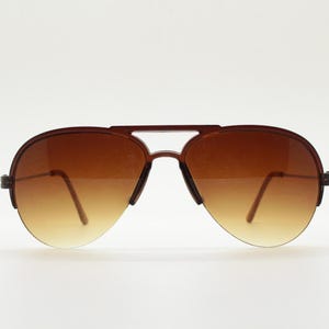 90s vintage small sized pilot aviator sunglasses. Transparent brown half frame with slim metal arms. Teardrop aviators. Unused NOS.