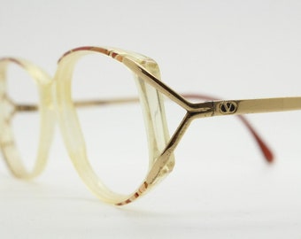 Valentino 90s vintage eye glasses made in Italy. Crystal and abstract pattern optical frames with golden forked arms. Prescription RX