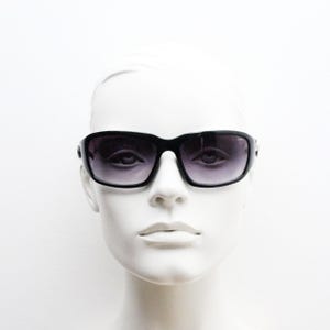 Y2k vintage wrap around bug eye sunglasses. Substantial curved black shield frame with arm holes. Modified 60s biker design. 2000&#39;s NOS
