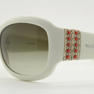 Valentino Y2k vintage wrap around bug eye sunglasses. Curving white acetate shield frame with orange and diamante stones. 2000s. Rhinestone