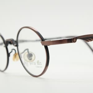 Paris Ma 90s vintage small oval eye glasses. Brushed bronze optical frames with scrolled arm details. Prescription. Steampunk spectacles NOS
