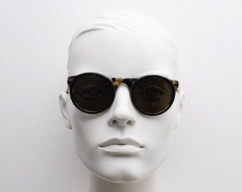 Francois Pinton Paris jaren 90 vintage ronde zonnebril gemaakt in Frankrijk. Dik acetaatmontuur voor dames in honingschildpadbruine tinten. NOS