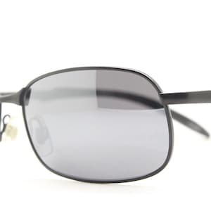 Y2K vintage wraparound sunglasses. Black satin matt finish on rectangular frame with slight mirror glaze lenses. 2000&#39;s. 90s. Unused NOS