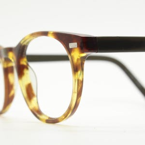 90s Vintage oval eye glasses. Tortoise gloss solid acetate 40s design optical frames with plain black arms. Prescription RX spectacles
