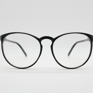 80s vintage black round glasses. Slightly oversized slim optical frames. Prescription eyeglasses with clear lens. RX spectacles
