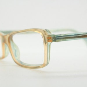 Alain Mikli rectangular eye glasses hand made in France. Low profile slim peach and blue transparent acetate optical frame. Prescription RX.