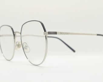 Bolon round panto flat top eye glasses model 7052. Slender silver metal optical frame with black brow. Prescription spectacles. Vintage RX