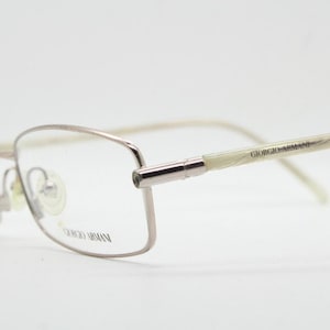 Giorgio Armani 90s vintage oval eye glasses made in Italy. Gold front with marbled white acetate arms. Optical frames. Prescription RX