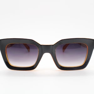 Y2K vintage rectangular cat eye sunglasses. Women&#39;s thick black and orange 60s style frame with graduating smoky lenses. 2000s BNWT