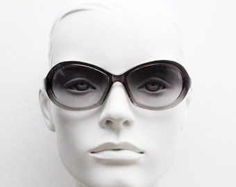 Y2K vintage oval bug eye sunglasses. Tasteful transparent grey acetate frame with matching graduated lenses. 2000s NOS. BNWT