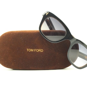 Tom Ford vintage modified wayfarer sunglasses made in Italy. Slightly cat eye form in black gloss acetate with superb graduating lenses