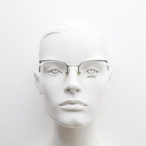 Sting 90s vintage round eye glasses. Minimal pewter finish metal half frame brow line optical frames. Prescription eyeglasses. RX. NOS