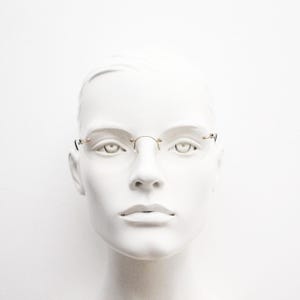 TRY vintage oval frameless eye glasses made in Italy. Futuristic minimal lightweight gold titanium optical frame. RX Spectacles