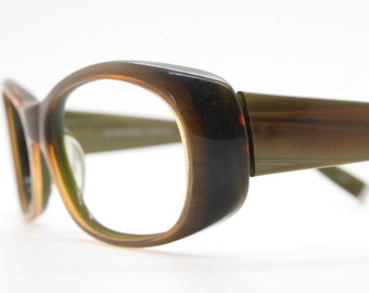 Oliver peoples 90s vintage big oval eye glasses made in Japan. Mottled brown acetate optical frame. Prescription wrap around. RX Spectacles