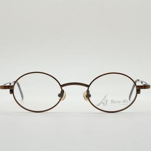 Paris Ma 90s vintage small oval eye glasses. Brushed bronze optical frames with charming arm details. Prescription. Steampunk spectacles NOS