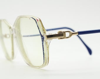 Silhouet jaren '80 vintage zeshoekige bril gemaakt in Oostenrijk. Transparant kristal optisch frame met abstract blauw patroon. Recept. jaren 70