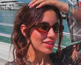 Vintage 90s oval cat eye sunglasses. Minimalistic low profile tortoise tone frame with plain brown lenses. Womens NOS