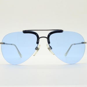 90s vintage small sized aviator sunglasses. Minimal grey satin solid metal half frame aviators with sky blue lenses. Unused NOS