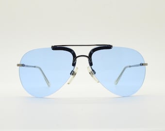 90s vintage small sized aviator sunglasses. Minimal grey satin solid metal half frame aviators with sky blue lenses. Unused NOS