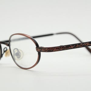 Paris Ma 90s vintage small oval eye glasses. Brushed copper finish optical frames with ornate details. Prescription steampunk spectacles NOS